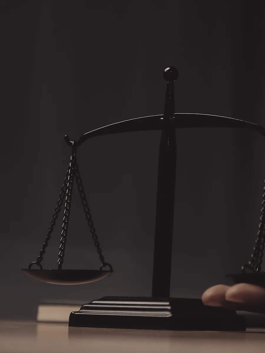 Scales of justice on a courtroom desk